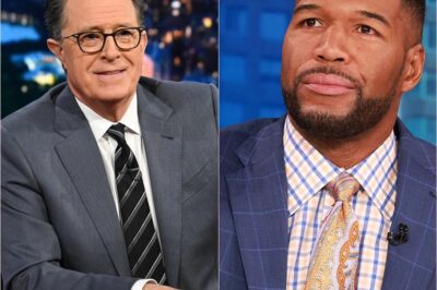 SHOCKING TWIST: Colbert loses bet, gets replaced by Strahan for a week – ratings EXPLODE! CBS forces Colbert to take ‘script rewrite leave’ after audience falls in love with Strahan’s hosting style!