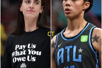 EXPLOSIVE CONTROVERSY: Brittney Griner Accused of Using Racial Slur Against Caitlin Clark — League SILENCE Fuels Fan Outrage and Double Standard Debate  In what is now being described as a defining flashpoint for the WNBA, a courtside camera reportedly caught Brittney Griner using a racial slur toward Caitlin Clark during a heated moment in a high-stakes game.  The video, though unverified, spread across social media in minutes — igniting a firestorm of accusations, speculation, and outrage.  But the real shock? The league’s silence.  No statements. No investigations. No suspensions.  Now, fans and analysts alike are asking: “What if the roles were reversed?”  Would the reaction have been the same if Clark had been the one caught uttering such a slur?  Critics argue that the league’s inaction exposes a painful double standard — one that favors certain players while leaving others to fend for themselves.  The incident has torn open a larger conversation about race, media narratives, and selective accountability in professional sports — and the consequences may be just beginning.  👇 Full breakdown and reactions in the article linked in the comments.
