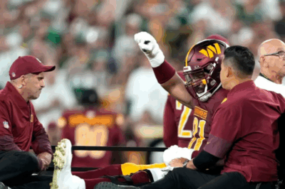 Washington Commanders star carted off field surrounded by teammates after devastating injury blow against Packers