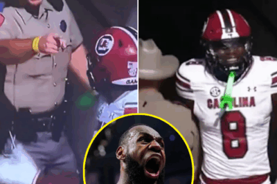 A viral sideline confrontation at Kyle Field has sparked outrage, with NBA superstar LeBron James demanding action. “That A&M cop needs to be suspended!” he wrote, calling attention to a Texas State Trooper’s aggressive contact with South Carolina players.